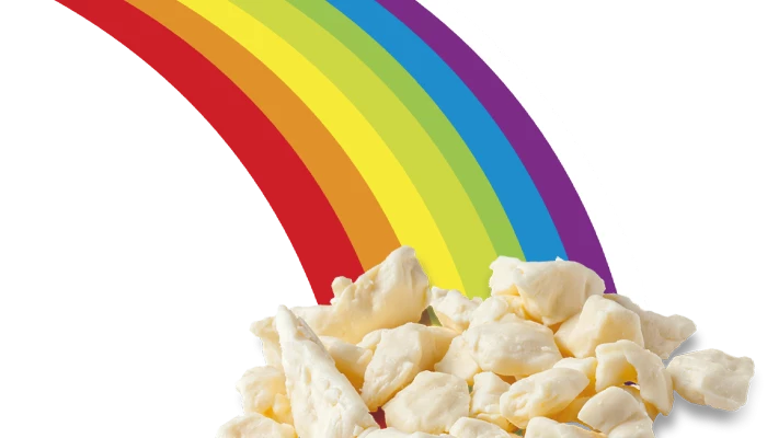 Montage d'un arc-en-ciel derrière du fromage en grains.